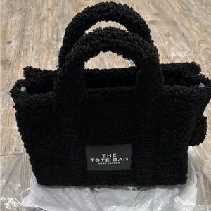 Marc Jacobs Teddy traveler tote bag in size small.
